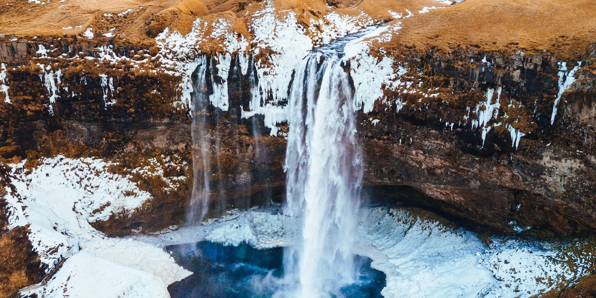 Dramatic Icelandic landscape with waterfalls and mountains