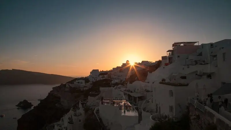 Sunset over Oia, Santorini with blue domes